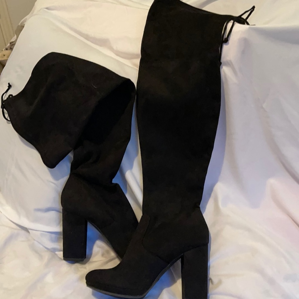 Black fabric boot. Over knee with draw string 4 inch heel. Pull on